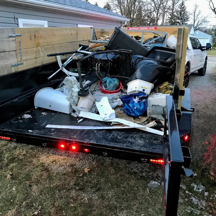 Roll-off dumpster delivered to a residential driveway in College